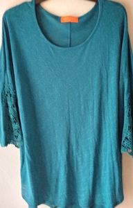 Teal top with beautiful detail on sleaves